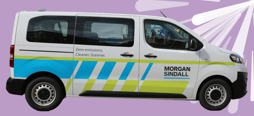 White Morgan Sindall electric van on a purple background.