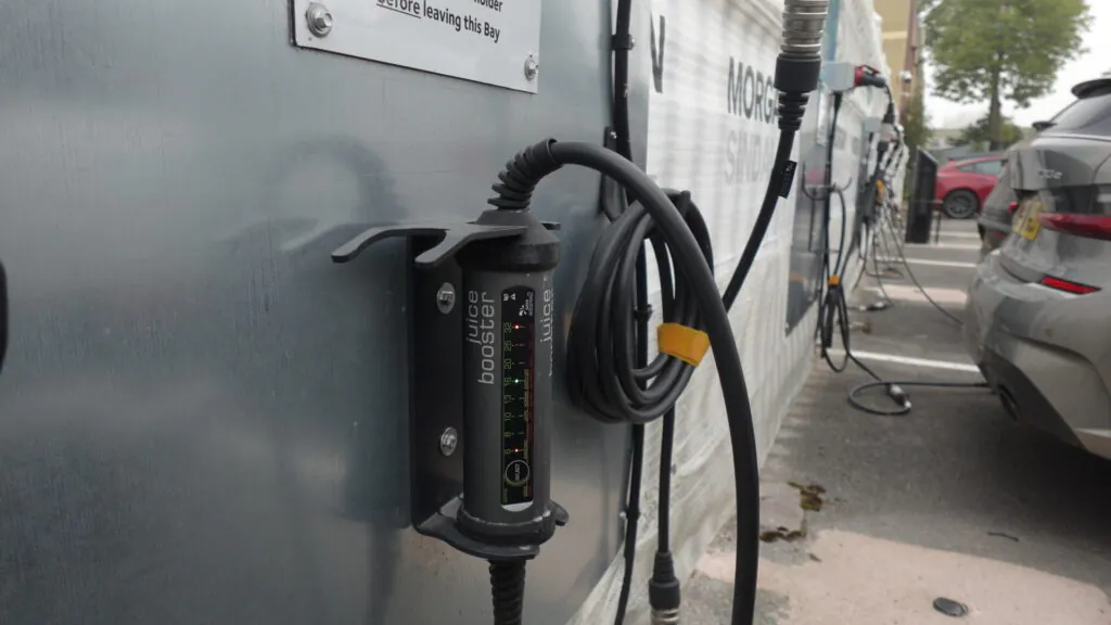 Close up of electric vehicle charging setup.