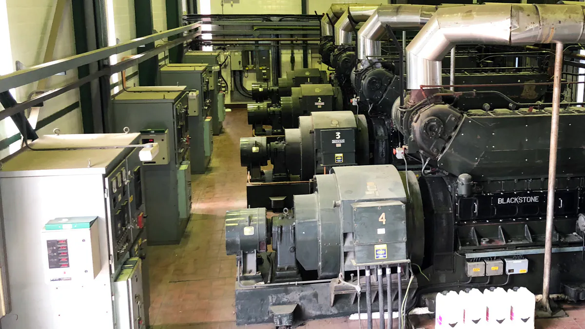 Interior of an industrial facility showing rows of large engines labeled "BLACKSTONE" with control panels alongside.