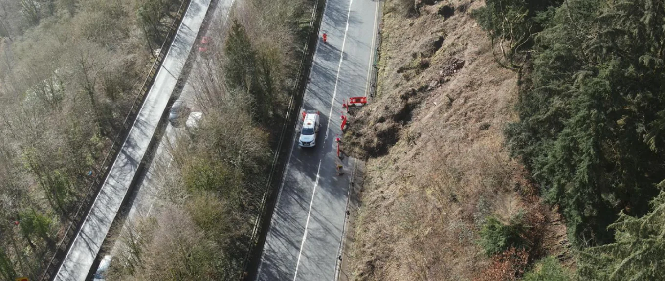 Aerial view of the A40 at Leys Bend showing the hillside affected by the rockfall that prompted emergency safety measures and permanent stabilisation works